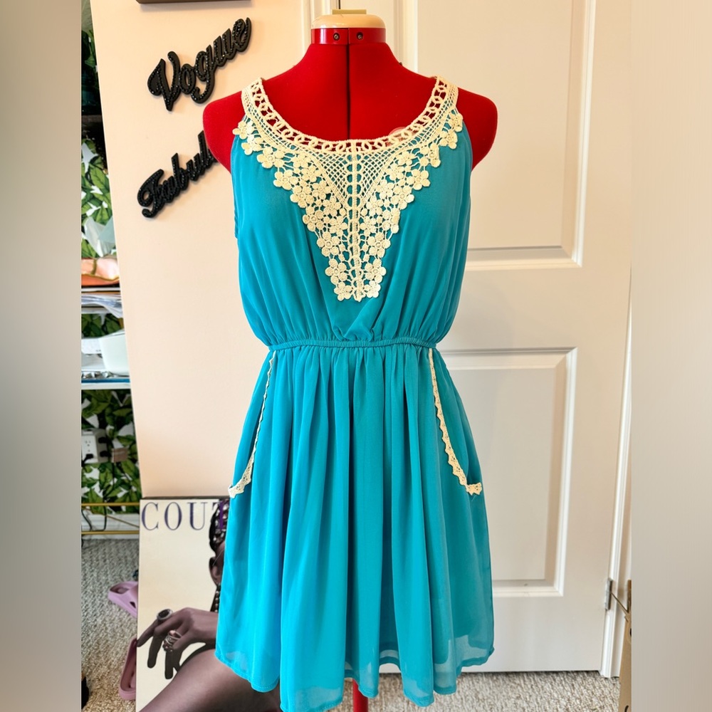 Maya, cute summer dress. Turquoise. Lined and light weight. Fun and flirty. NWT